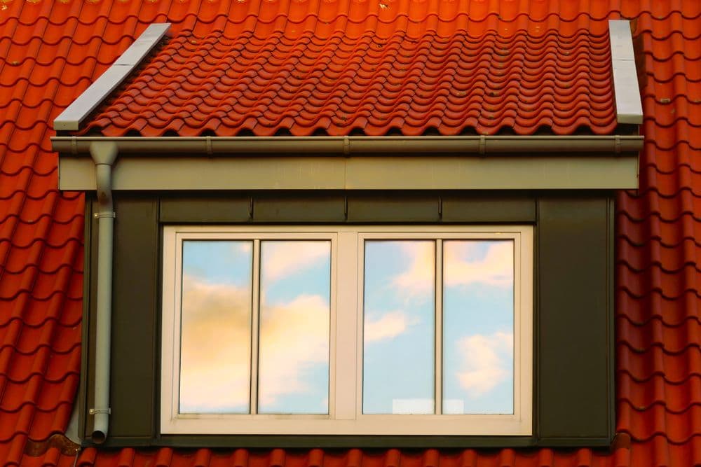 Red tiled roof with a rooftop window